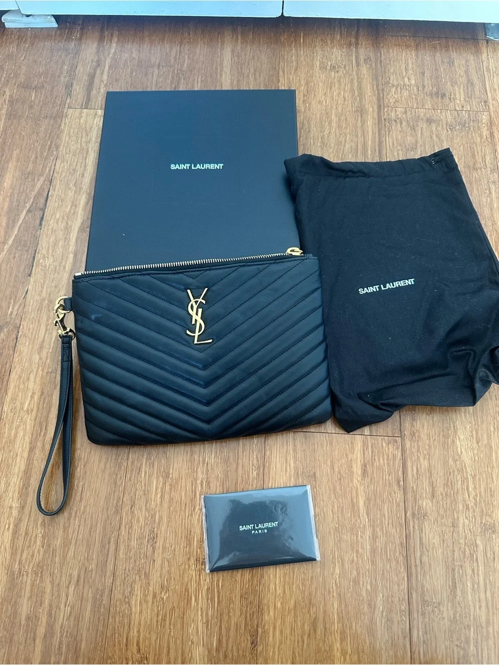 Saint Laurent Black Quilted Leather Wristlet with Gold YSL Emblem